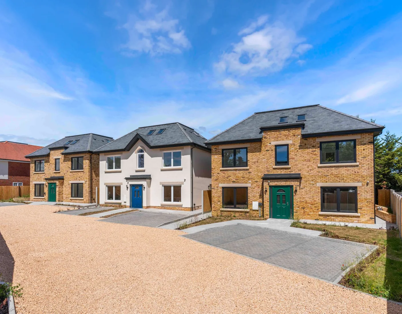 Oak Gate's three detached homes behind the private entrance in Goffs Oak